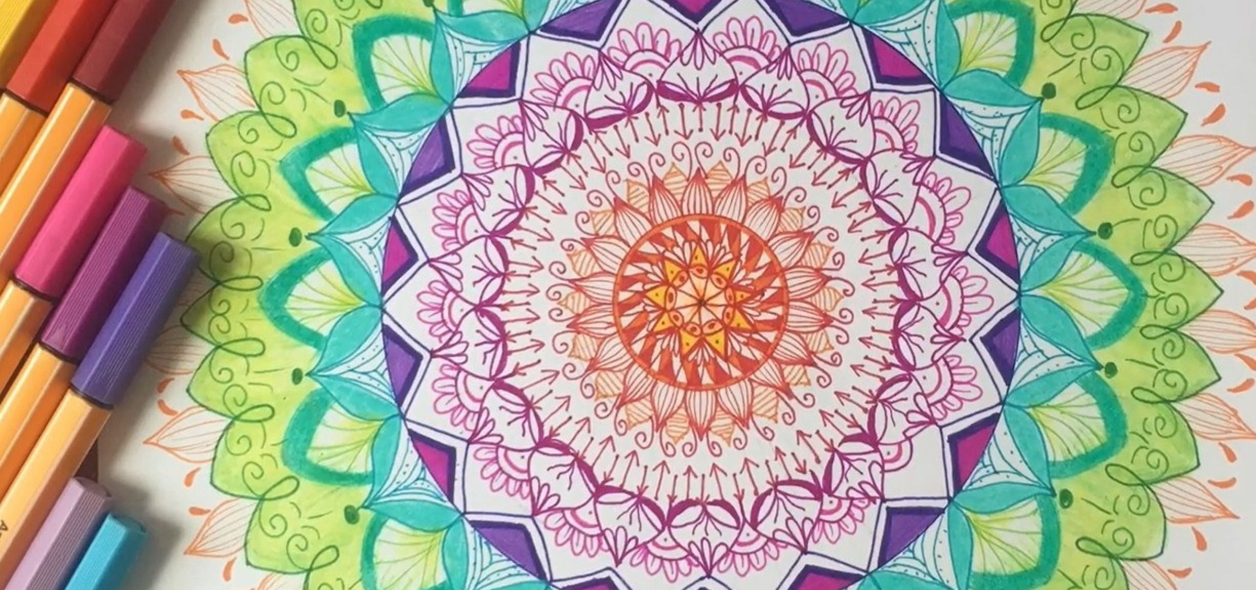 colourful mandala artwork made with fine pens and textas