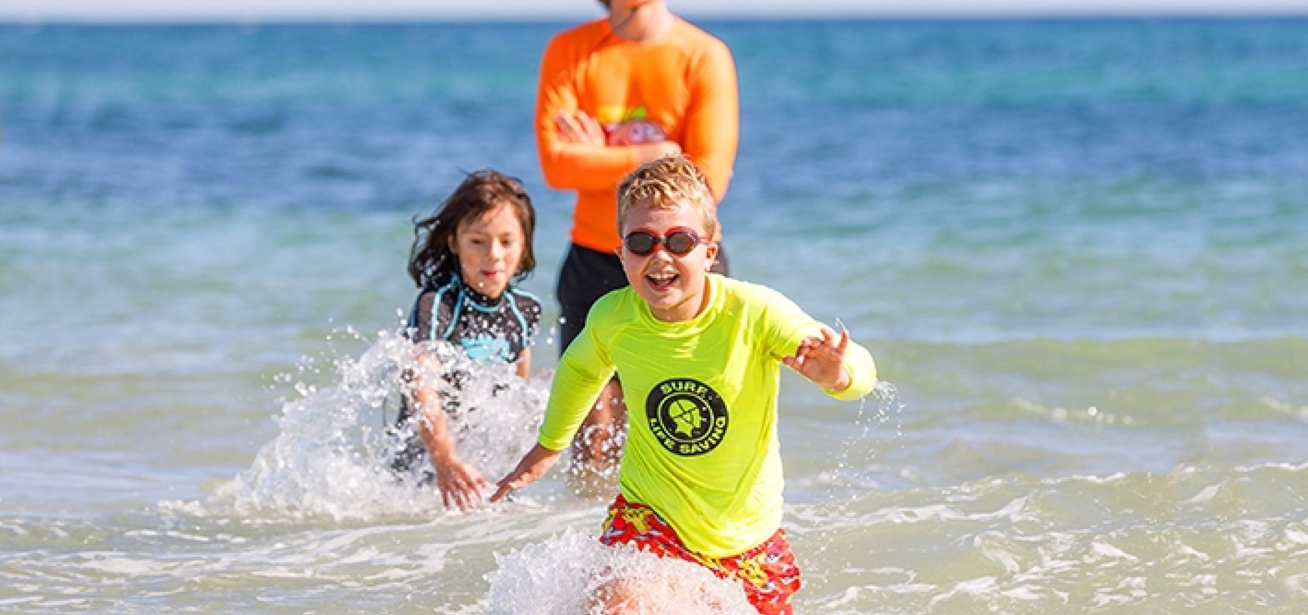 people wadding in water