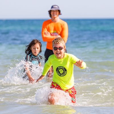 people wadding in water