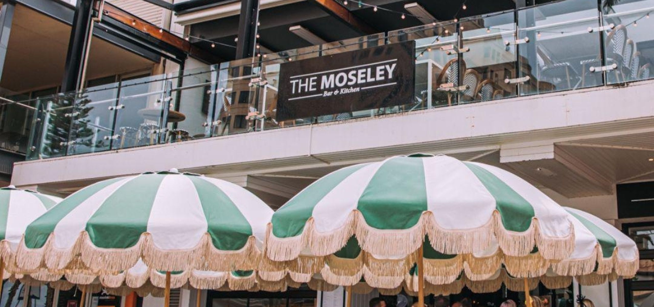 Outside the Moseley umbrellas and people waiting to enter venue