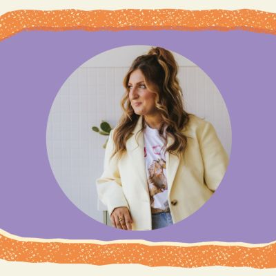 Female in blazer, framed by a purple circle