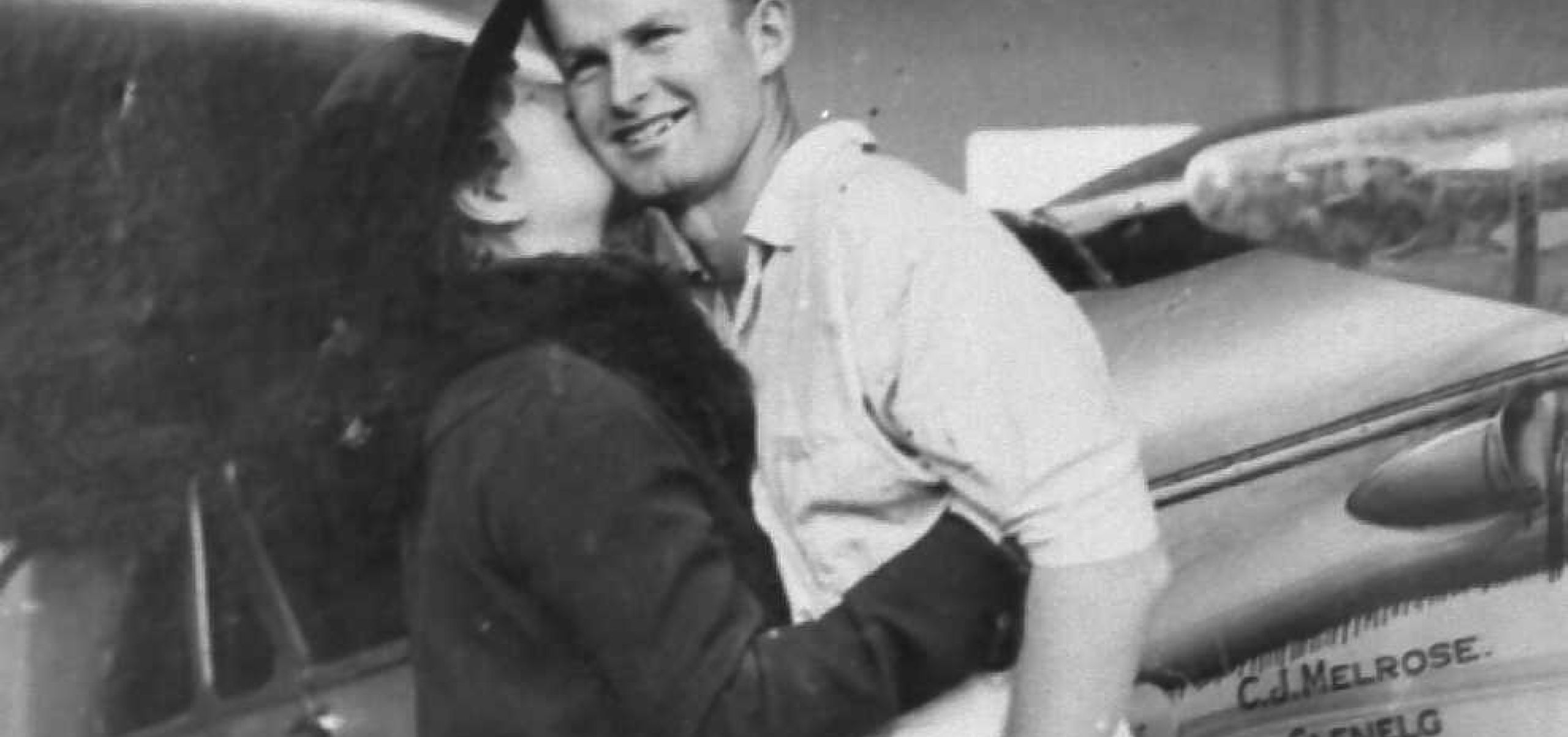 Jimmy Melrose being embrassed by a woman