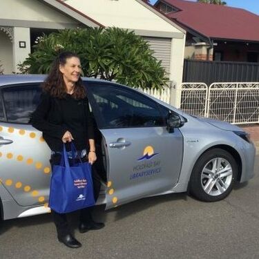 librarian delivery books to home clients