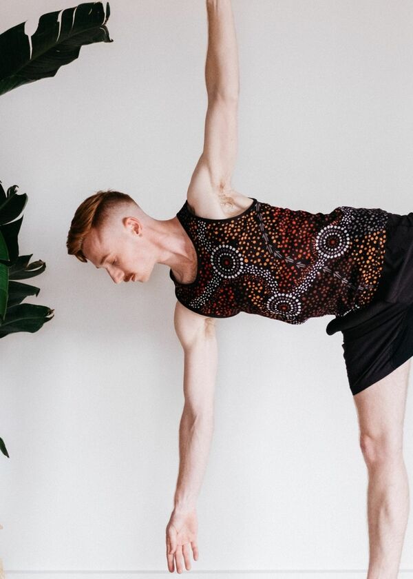 Person in a yoga pose, balancing on one leg