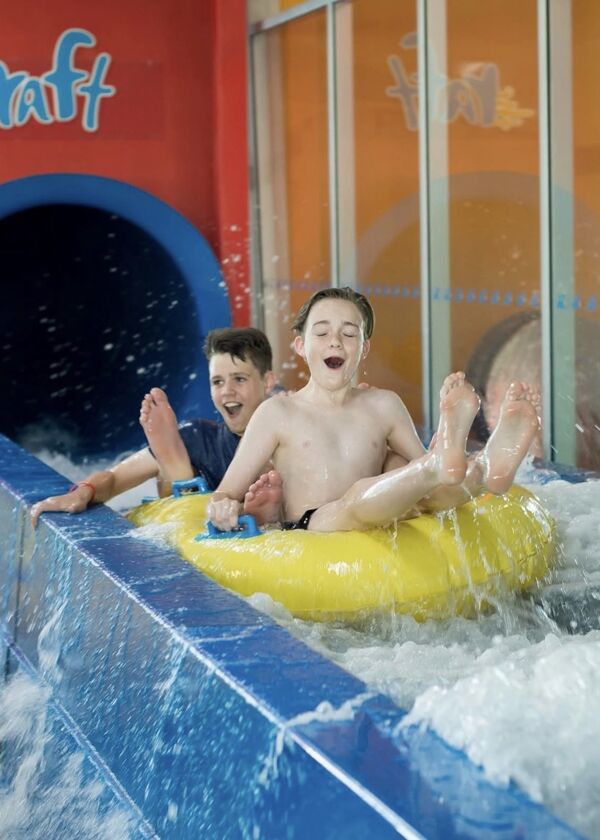 Two boys on water slide