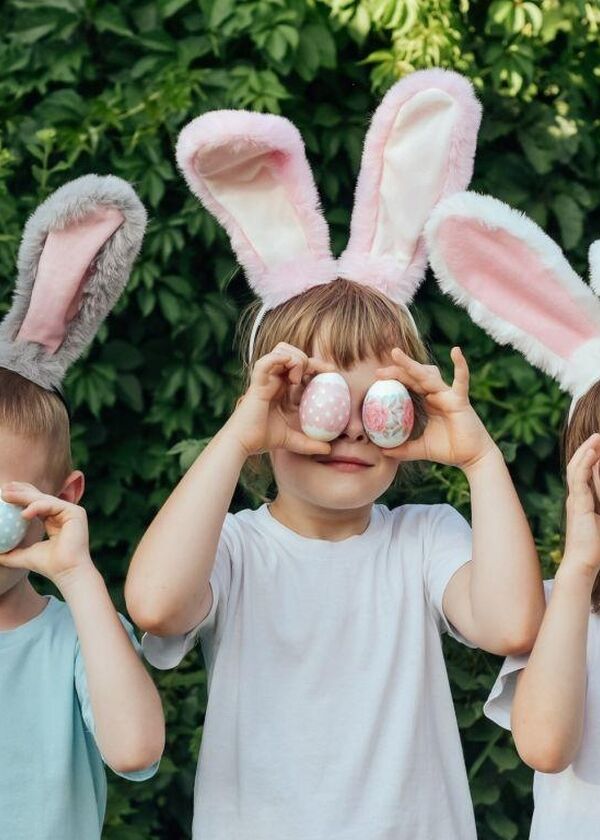 Children with easter eggs over their eyes