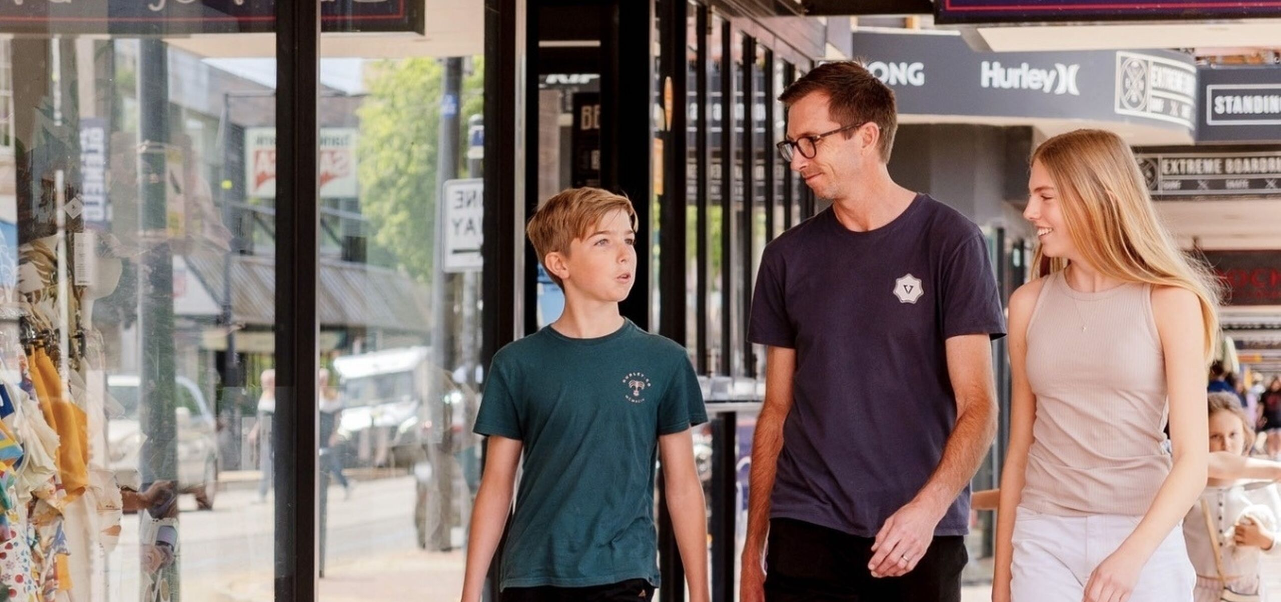 three people walking down jetty road glenelg