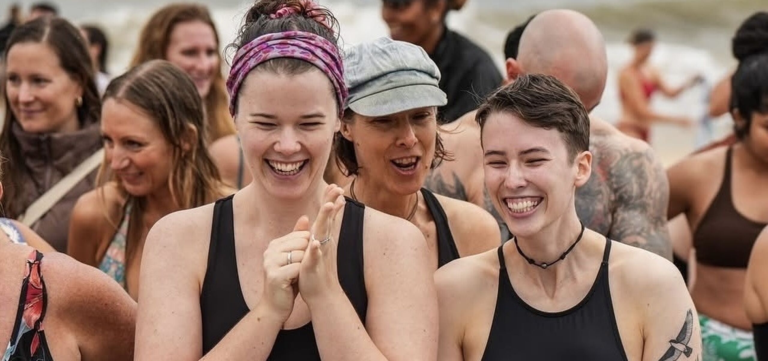 Two people at the beach smiling