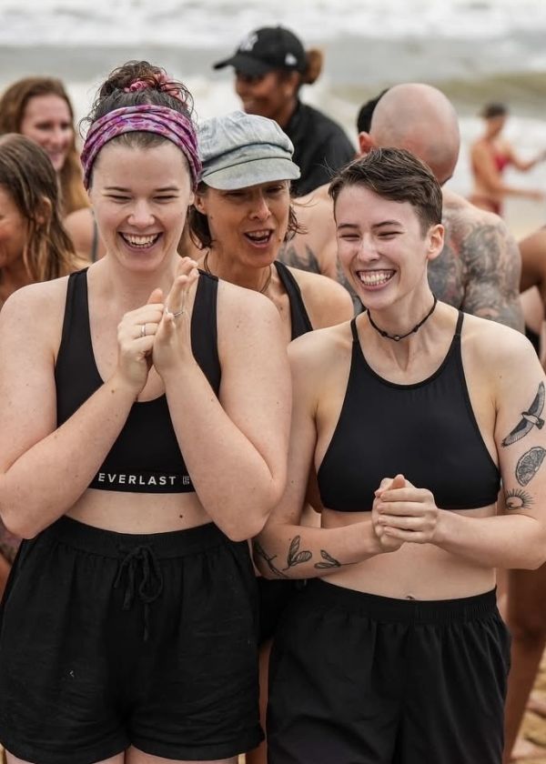 Two people at the beach smiling