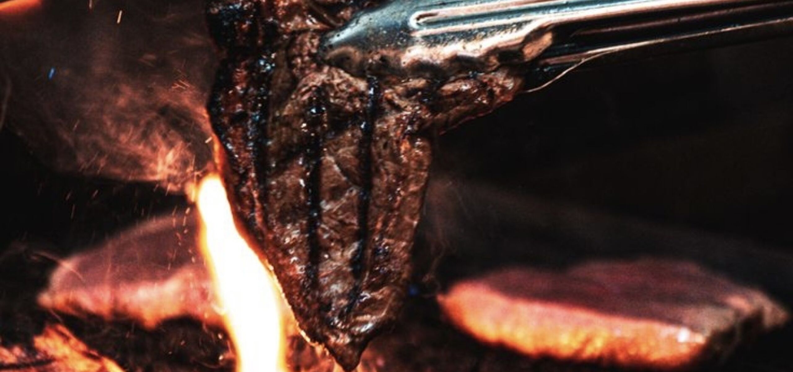 Steak being cooked on a BBQ
