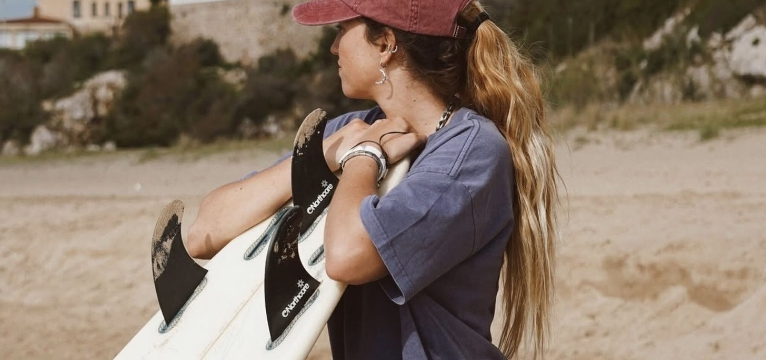 woman holding surfboard