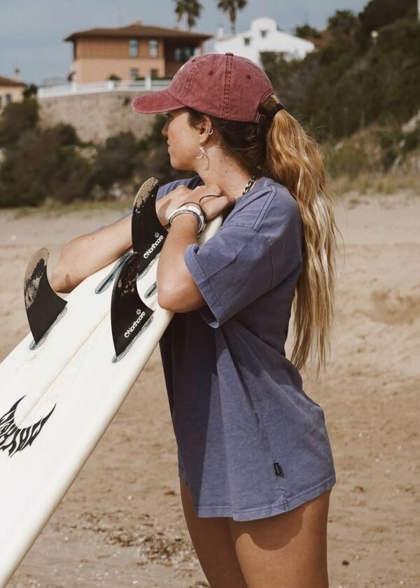 woman holding surfboard