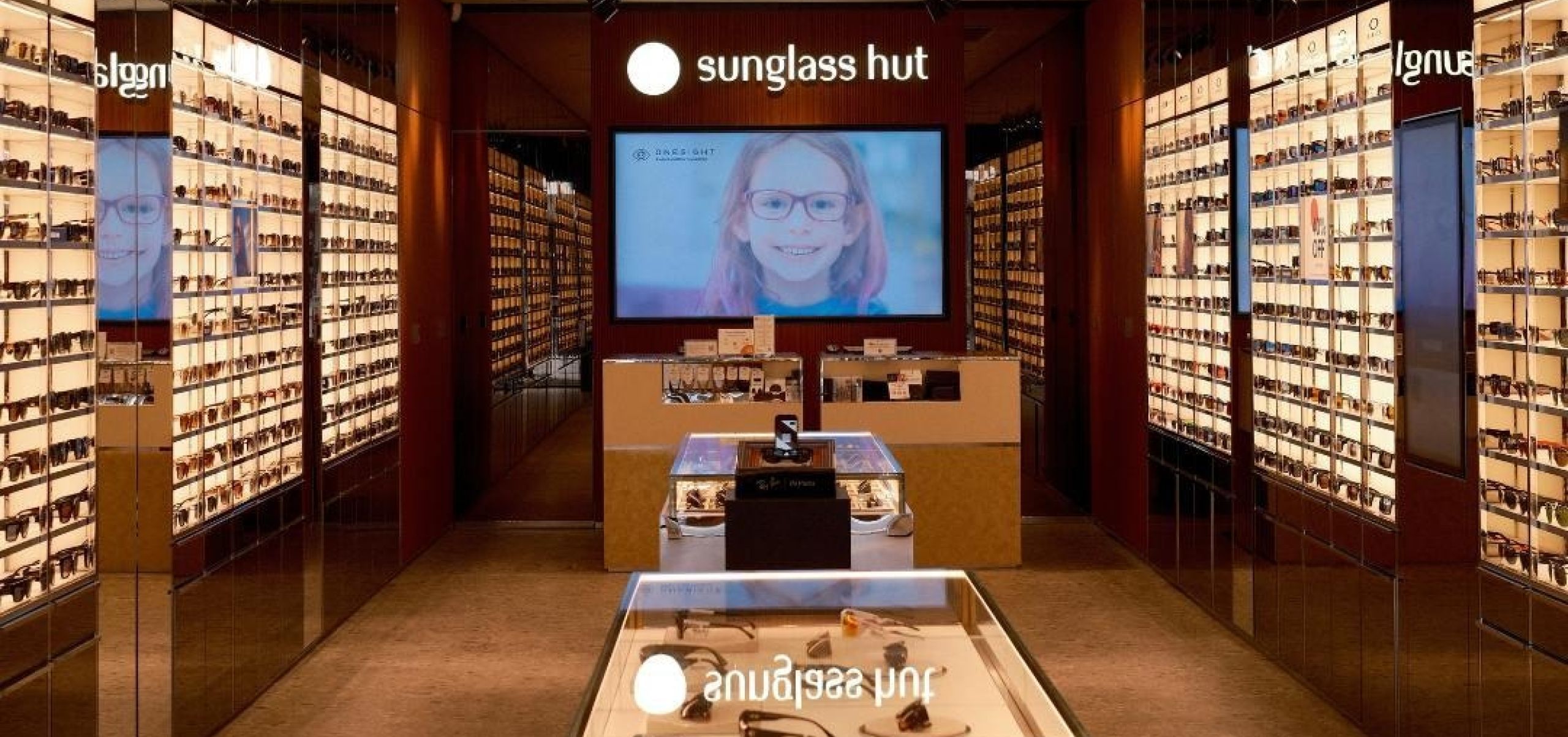 walls of sunglasses inside sunglasses hut