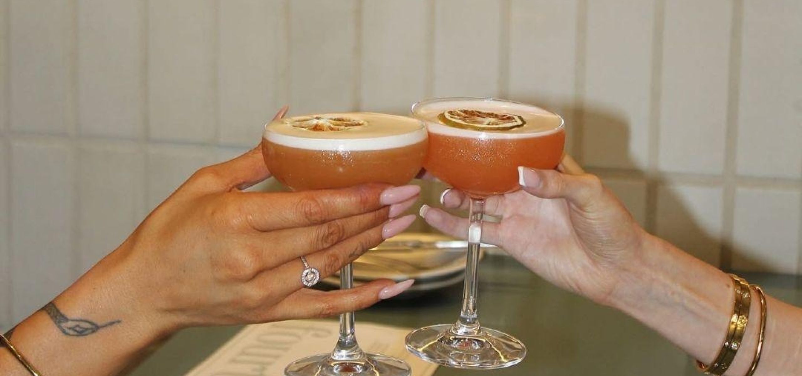 people cheersing with cocktails