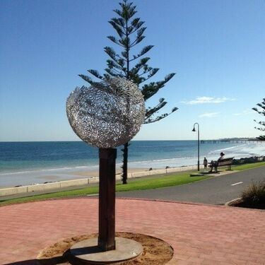 Empty vessel sculpture along the beachfront