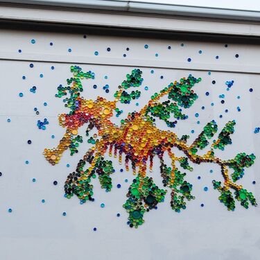 seadragon artwork made out of colourful bottlecaps